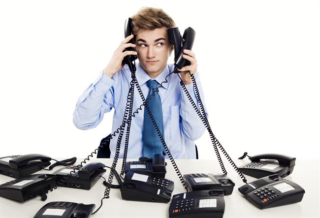 Man answering many phones at once