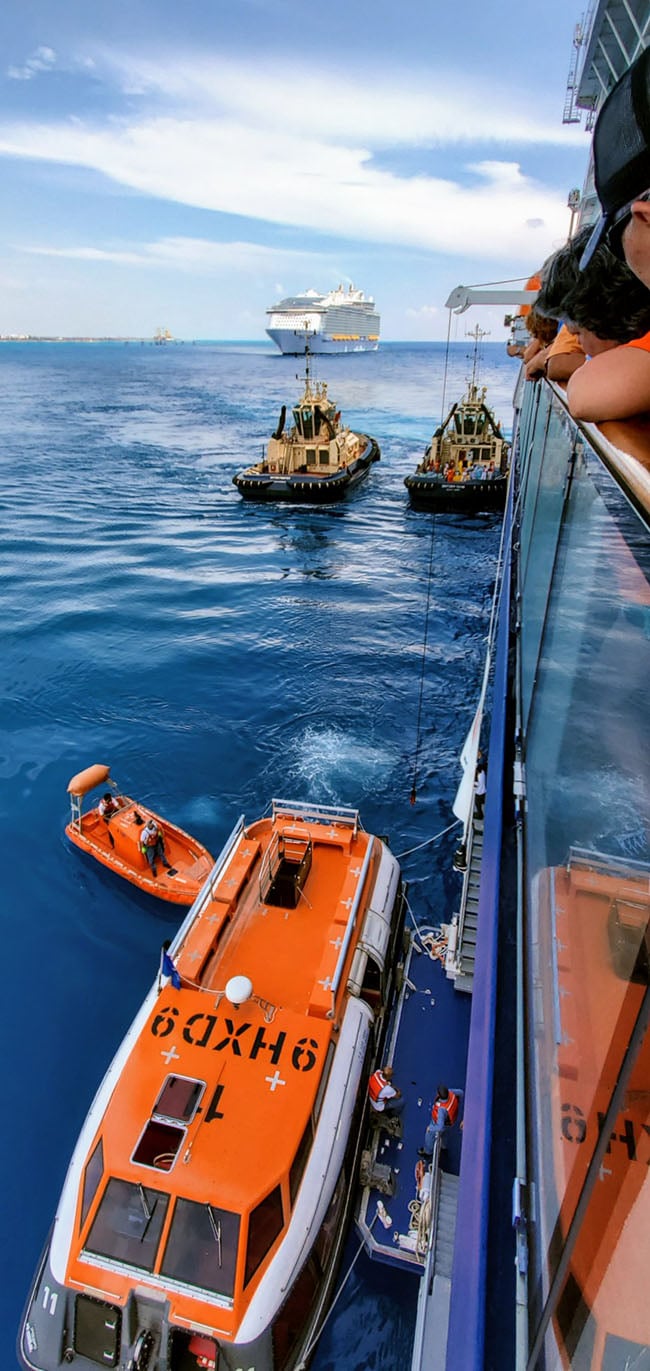 Crew and Supplies Getting Loaded from Equinox onto Boats to Head to Freeport - Symphony of the Seas Doing the Same in the Background