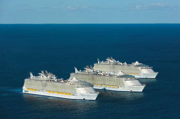 Oasis of The Seas, Allure of The Seas, and Harmony of The Seas next to each other at sea