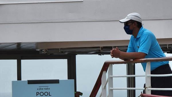 A security Guard Watching Over Sunbathers on a Cruise Ship