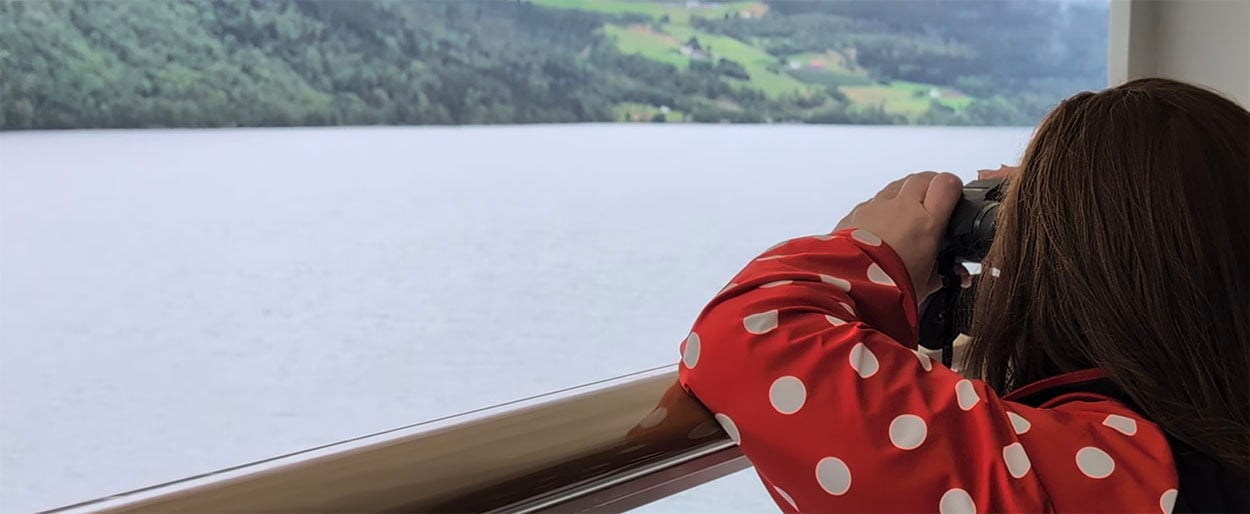 Audrey looking at the Norwegian Fjords while sailing on Disney Fantasy