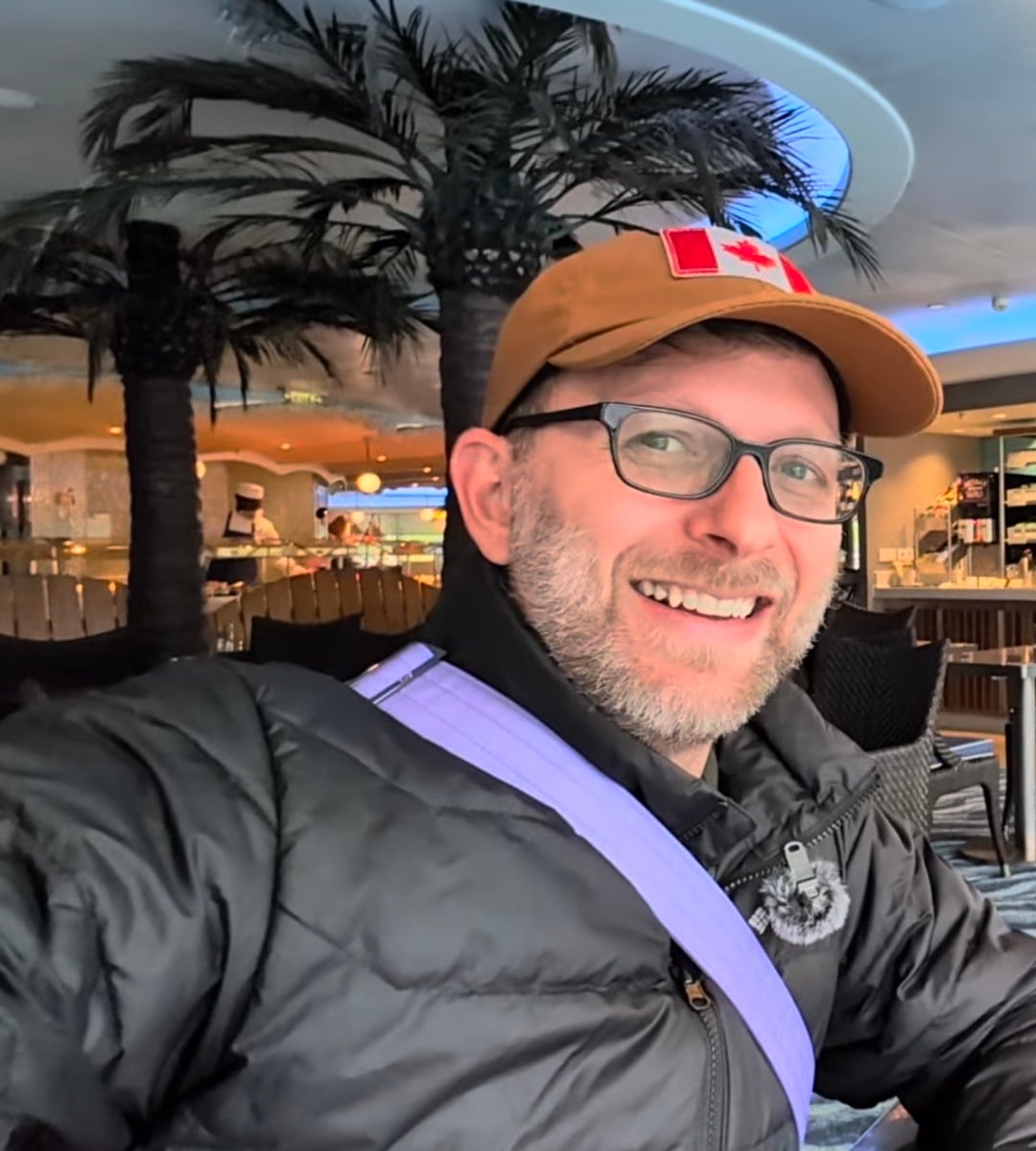 Billy wearing a Canada hat and plain black jacket in Cabanas on Disney Fantasy in Norway