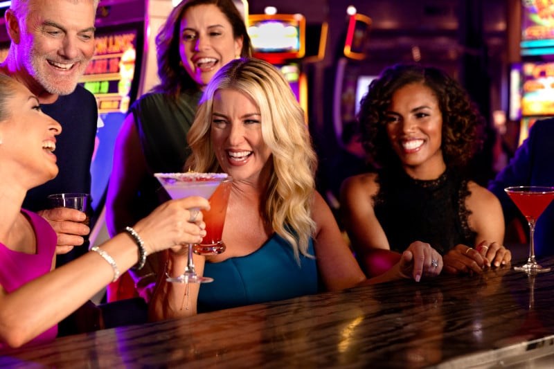 People having drinks in the casino on Royal Caribbean