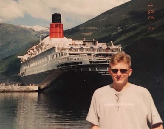 Billy Standing in front of Cunard's QE2 in Norway, 2001