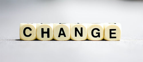 scrabble letters spelling "change"