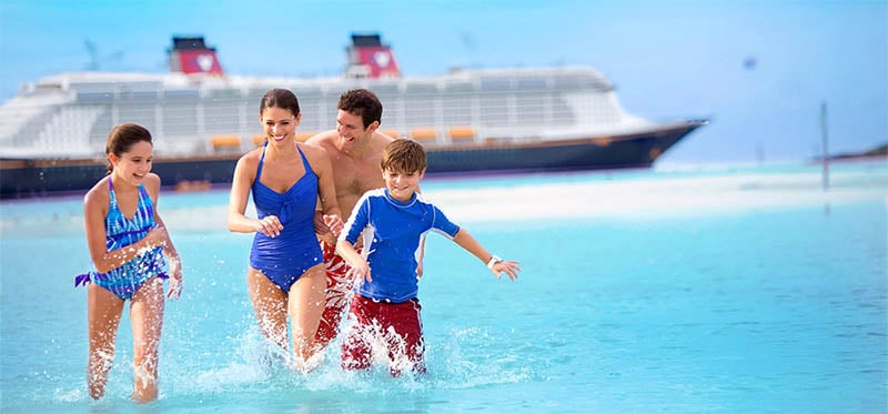 Family Running on Beach at Disney's Private Island, Castaway Cay