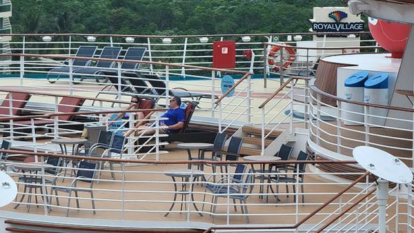 Guests on Adventure of the Seas as Seen from Celebrity Edge - Masks Required on Adventure When Indoors or Not Distanced